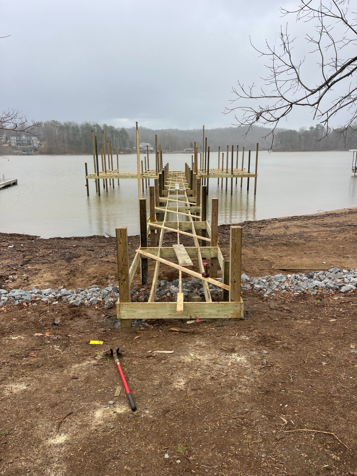 Dock pilings and rip rap shoreline during construction on a TVA reservoir