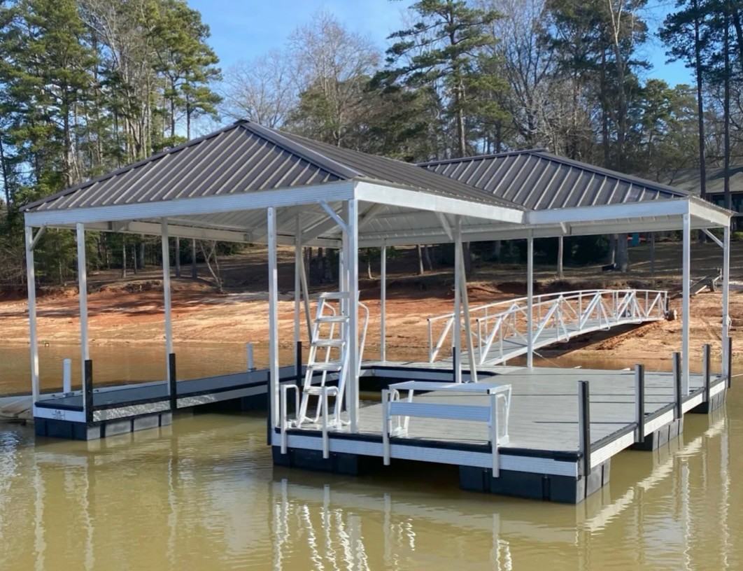 Covered floating boat dock with aluminum gangway on a lake